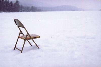 metal chair on frozen lake