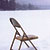 chair on frozen lake