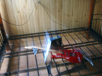 Red Guitar on lower bunk of beds