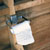 interior of toilet filled with snow and a toilet roll enscribed with text