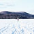 figure in distance on frozen lake