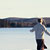 whitehead walking on frozen lake with porcupine stick